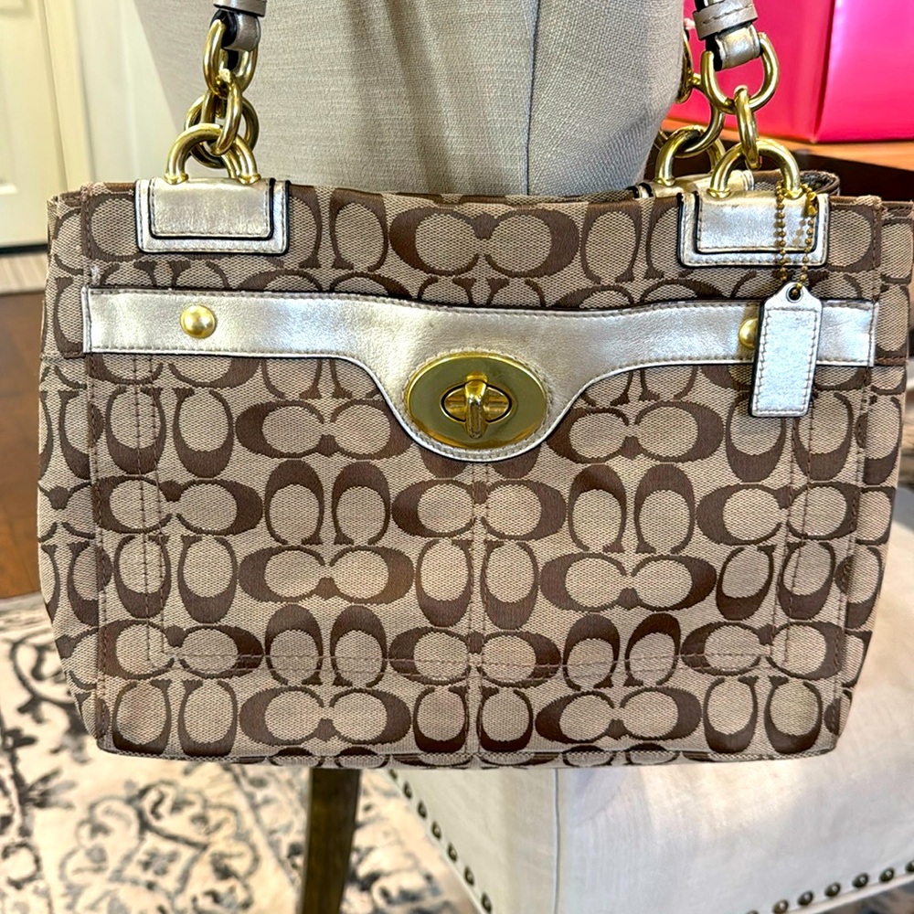 Coach 
Brown, tan, monogram
Used, good condition